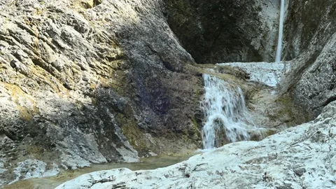 Waterfall on rocks in a canyon Stock Footage 211503893