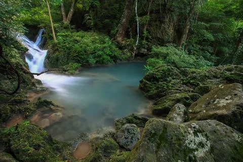 Waterfall on rocks in forest Stock Photos