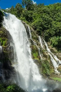 Waterfall with rocks in the middle of the jungle Stock Photos