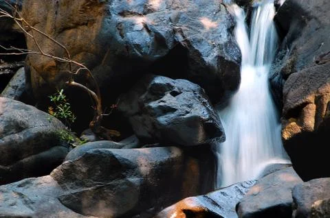 Waterfall in the rocks Stock Photos