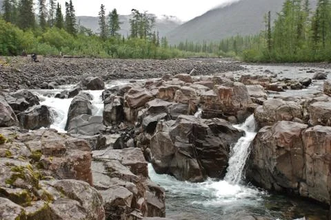 Waterfall in the rocks Stock Photos