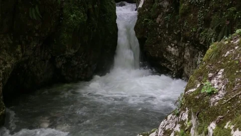 Waterfall in the rocks, the river flowing through a narrow crack, Abkhazia .. Stock Footage