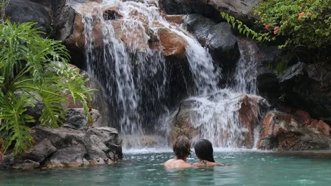 Waterfall with romantic couple bathing having fun Stock Footage 71239438