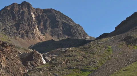 Waterfall in Rugged Mountains 2 Stock Footage 8548506