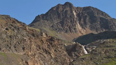 Waterfall in Rugged Mountains Stock Footage 8548512