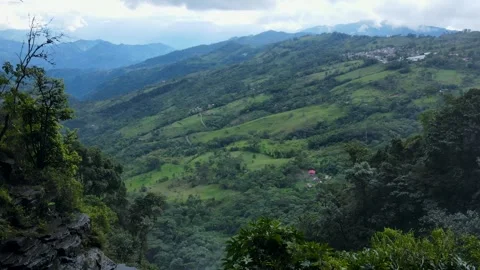 Waterfall seen from cave opening over green Tisquizoque valley Stock-Footage 331410707