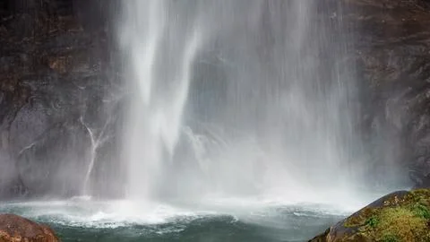A waterfall is shown in the image Stock Photos