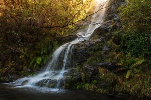 Waterfall with silk effect in the Lanjaron river, Sierra Nevada, Granada. Stock Photos