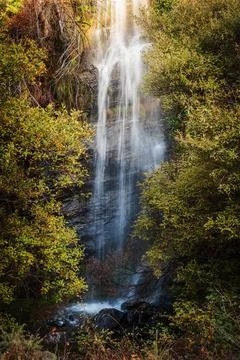 Waterfall with silk effect in the Lanjaron river, Sierra Nevada, Granada. Stock Photos