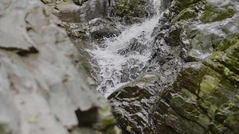 Waterfall in Slow Motion - Deep woods and strange rock formation #1 Stock Footage 90628554