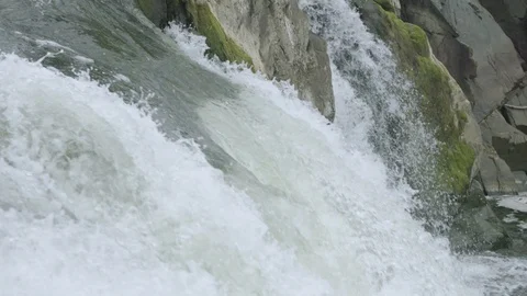 Waterfall in slow motion over mossy cliff face in Great Falls Park Video stock 91902606