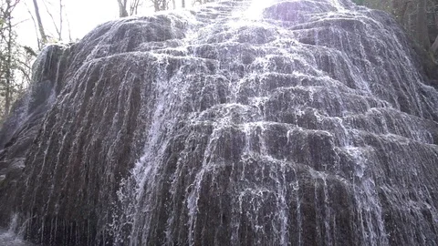 Waterfall at slow motion in the stone monastery Stock Footage 87738169