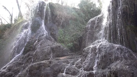 Waterfall at slow motion in the stone monastery Stock Footage 87738319