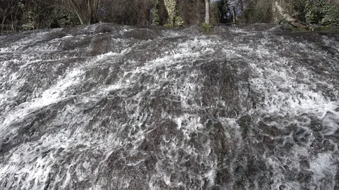 Waterfall at slow motion in the stone monastery Stock Footage 87754370