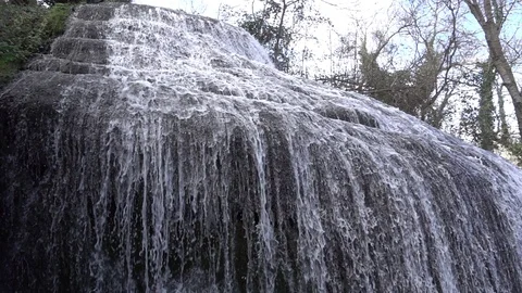 Waterfall at slow motion in the stone monastery Stock Footage 87755574