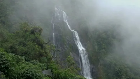 The waterfall is slowly covered by mist Stock Footage 270925252