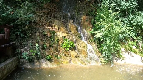 Waterfall from a small mountain river in low mountains Stock Footage 104520343