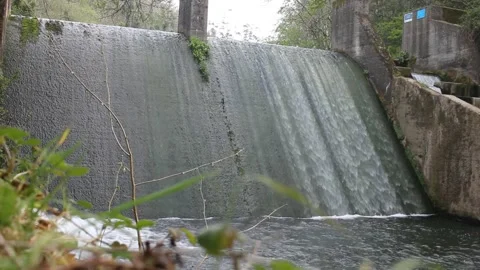 Waterfall in a small reservoir Stock Footage 239913100
