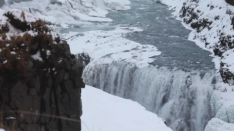 Waterfall with snow in Iceland Stock Footage 122375475