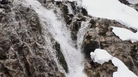 Waterfall in snowy landscape Stock Footage 18176917