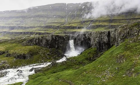 Waterfall somewhere in the wilderness. Stock Photos