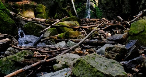 Waterfall splash, spring water as it falls and dribbles on rocks covered Stock Footage 126008193