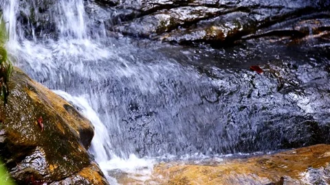 Waterfall Splashes Onto Rocks Stock Footage 74643875