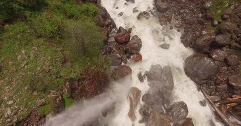 Waterfall Splashes into Rocky Creek Stock Footage 81003204