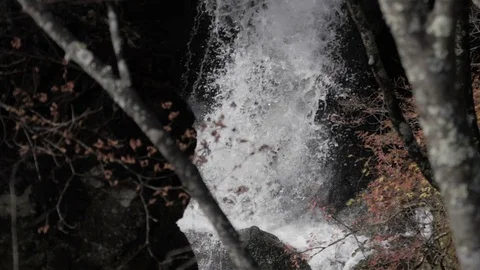 Waterfall splashing on rock in forest Stock Footage 104924524