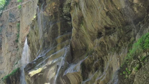 Waterfall splashing on the rocks. super clean and cold waterfall Stock Footage 131992122