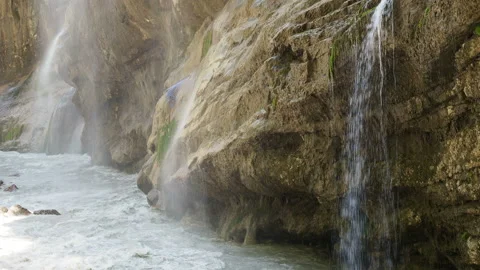 Waterfall splashing on the rocks. super clean and cold waterfall Stock Footage 131992683