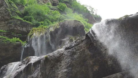Waterfall splashing on the rocks. super clean and cold waterfall Stock Footage 131993246