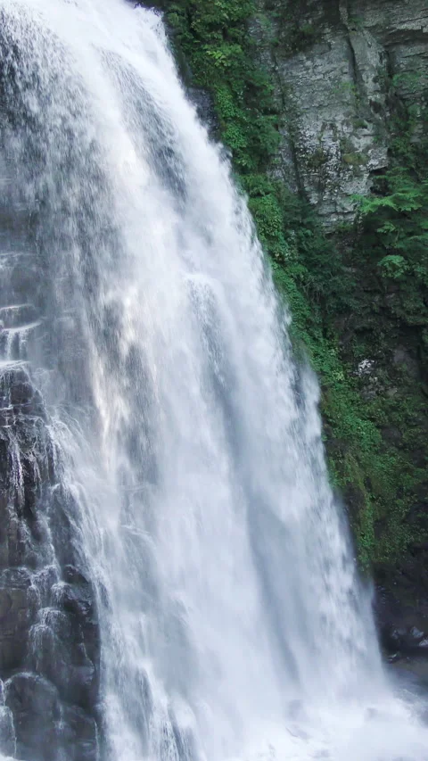 Waterfall Spray Against Rock Face Close Up Vertical Video Stock Footage 346195400