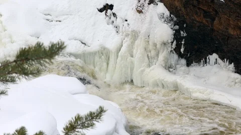 Waterfall, spring river with ice and snow Stock Footage 106008784