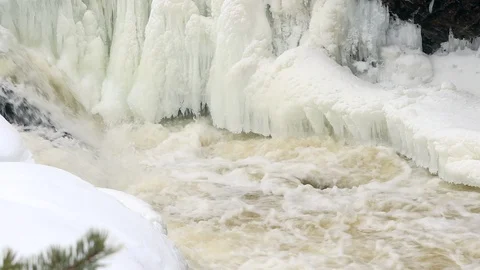 Waterfall, spring river with ice and snow Stock Footage 106009086