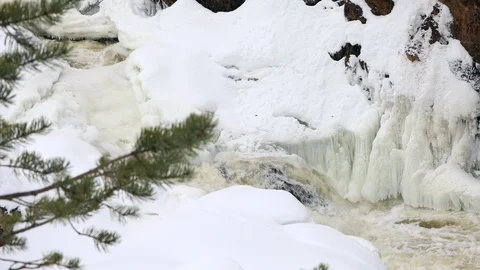 Waterfall, spring river with ice and snow Stock Footage 106009271