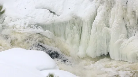 Waterfall, spring river with ice and snow Stock Footage 106009434