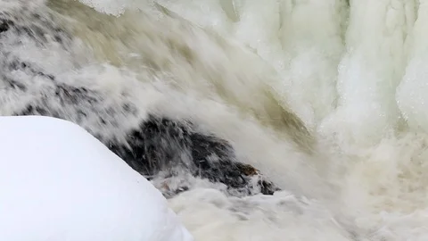 Waterfall, spring river with ice and snow Stock Footage 106009772