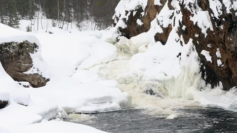 Waterfall, spring river with ice and snow Stock Footage 106009941