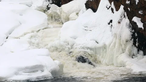 Waterfall, spring river with ice and snow Stock Footage 106011034