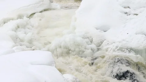 Waterfall, spring river with ice and snow Stock Footage 106011180