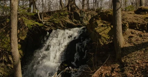 Waterfall in spring time with icicles on the rocks Video stock 60951512