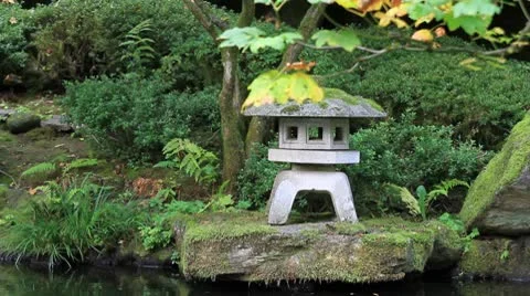 Waterfall with Stone Lantern in Japanese Garden Stock Footage