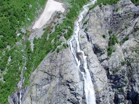 Waterfall in stone Mountains Aerial 4K video. Nature Travel Tourism Background Stock Footage 80314526