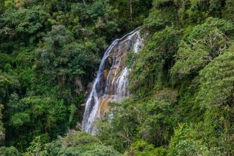 Waterfall on the stone paved path Inca Trail to Machu Picchu. Stock Photos