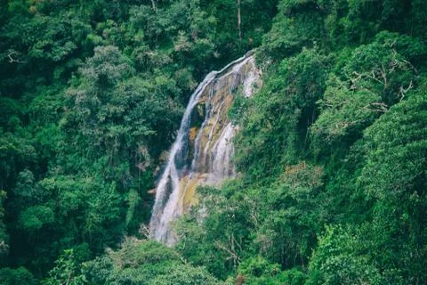 Waterfall on the stone paved path Inca Trail to Machu Picchu. Stock Photos