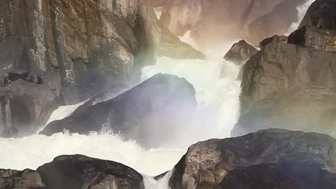 Waterfall in stones with rainbow VerticalPan Stock-Footage 84039616