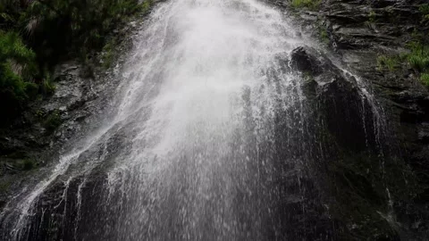 Waterfall a stormy stream of falling water down from the cliff Stockbeeldmateriaal 137920008