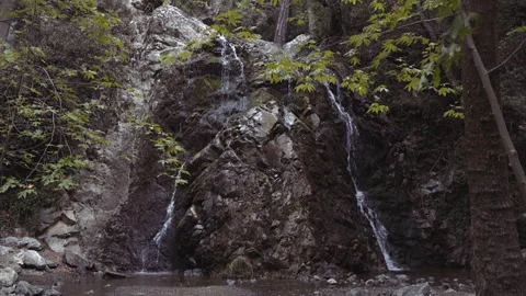 Waterfall stream falling down from mountain rock top Stock Footage 132470959