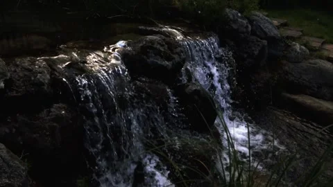 Waterfall from the stream to the lake of the mansion Video stock 138113064